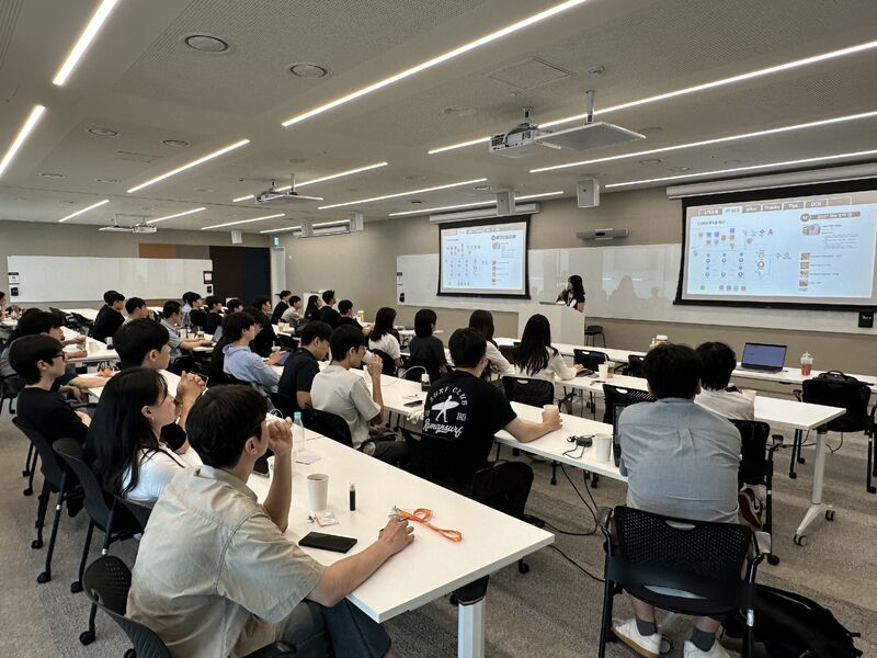 Participants listening to the project and architecture session